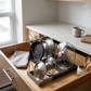 7-Grid Telescopic Pot & Lid Organizer in a practical small-space lifestyle setting