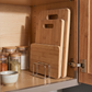 Stainless Steel Pot Lid & Cutting Board Organizer in a practical small-space lifestyle setting