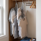 3-Piece 9-Hole Foldable Space-Saving Hangers in a practical small-space lifestyle setting