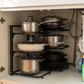 Adjustable Stainless Steel Pot & Pan Organizer in a practical small-space lifestyle setting