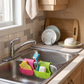 Double-Sink Saddle Caddy with Drainage in a practical small-space lifestyle setting