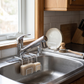 Metal Sink Caddy for Sponges and Soap in a practical small-space lifestyle setting