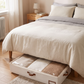 Foldable Under-Bed Blanket Organizer with Clear Window in an everyday small-space setting