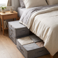 Foldable Under-Bed Blanket Storage Bag in a compact bedroom lifestyle setting