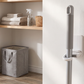 Self-Adhesive Wall-Mounted Broom & Mop Clip in a practical small-space lifestyle setting