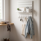 Wall-Mounted Pegboard Organizer with Hooks in a practical small-space lifestyle setting