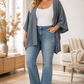 Woman wearing a grey oversized waffle-knit open cardigan
